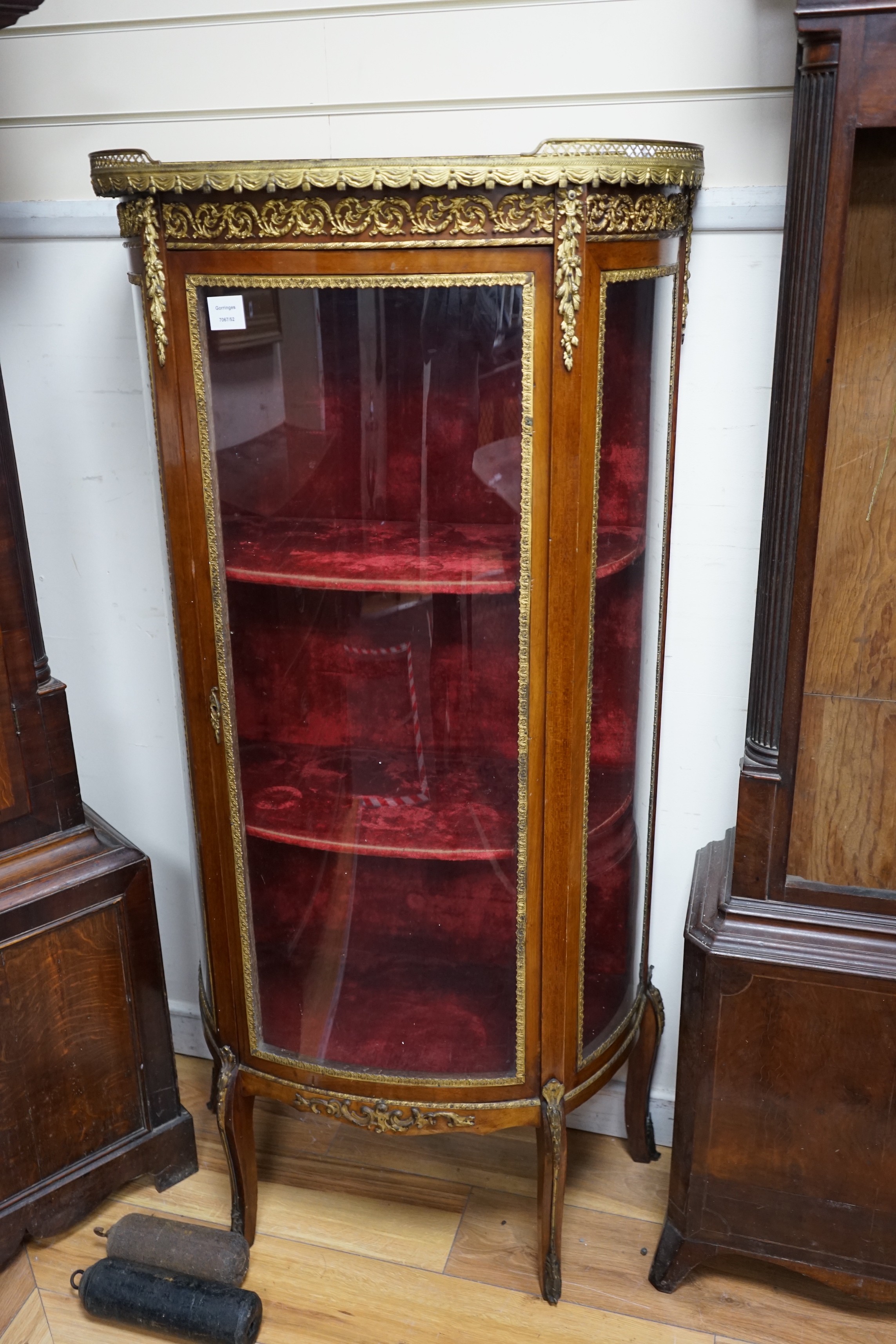 An early 20th century French gilt metal mounted mahogany vitrine, width 66cm, depth 32cm, height 138cm